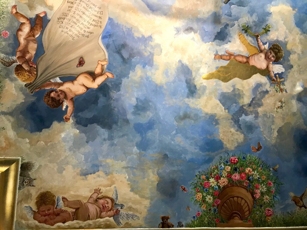 ceiling mural with sky and cherubs